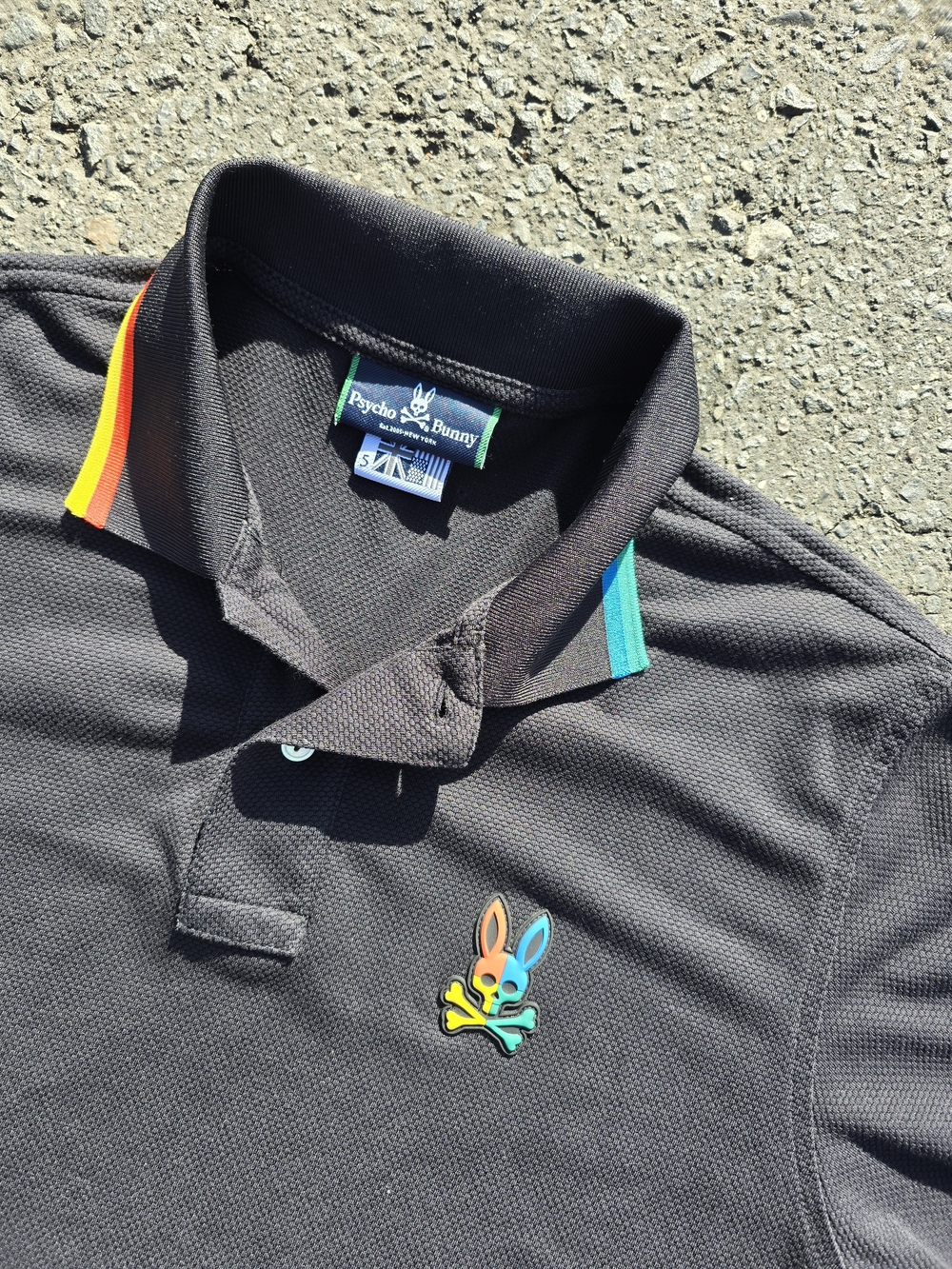 Psycho Bunny Black Polo with Green Accent Trim and White Logo